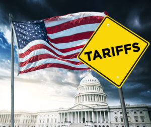 White House with American flag and a yellow ‘TARIFFS’ yield sign in the foreground